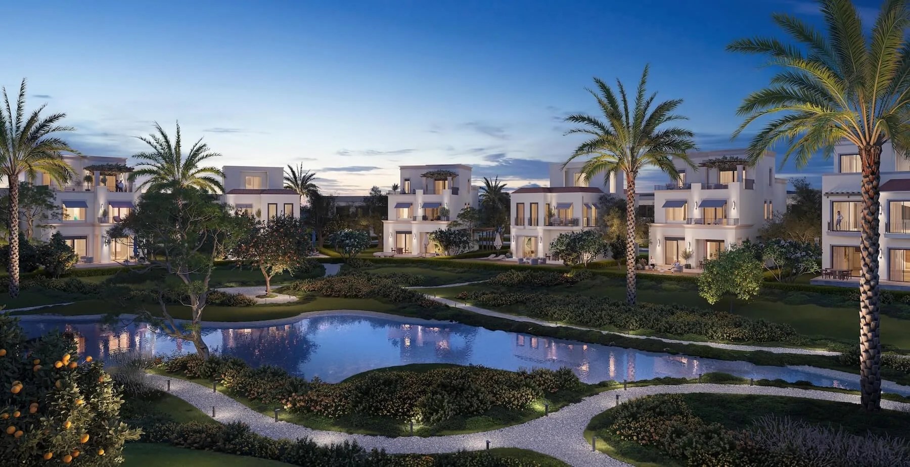 Architectural rendering of Mivida Emaar villas along the lagoon at dusk
